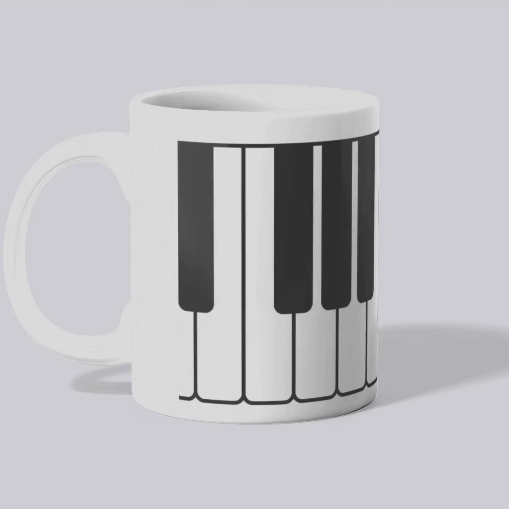 Mug blanc céramique 325ml orné d'une illustration d'un clavier de piano. Vidéo