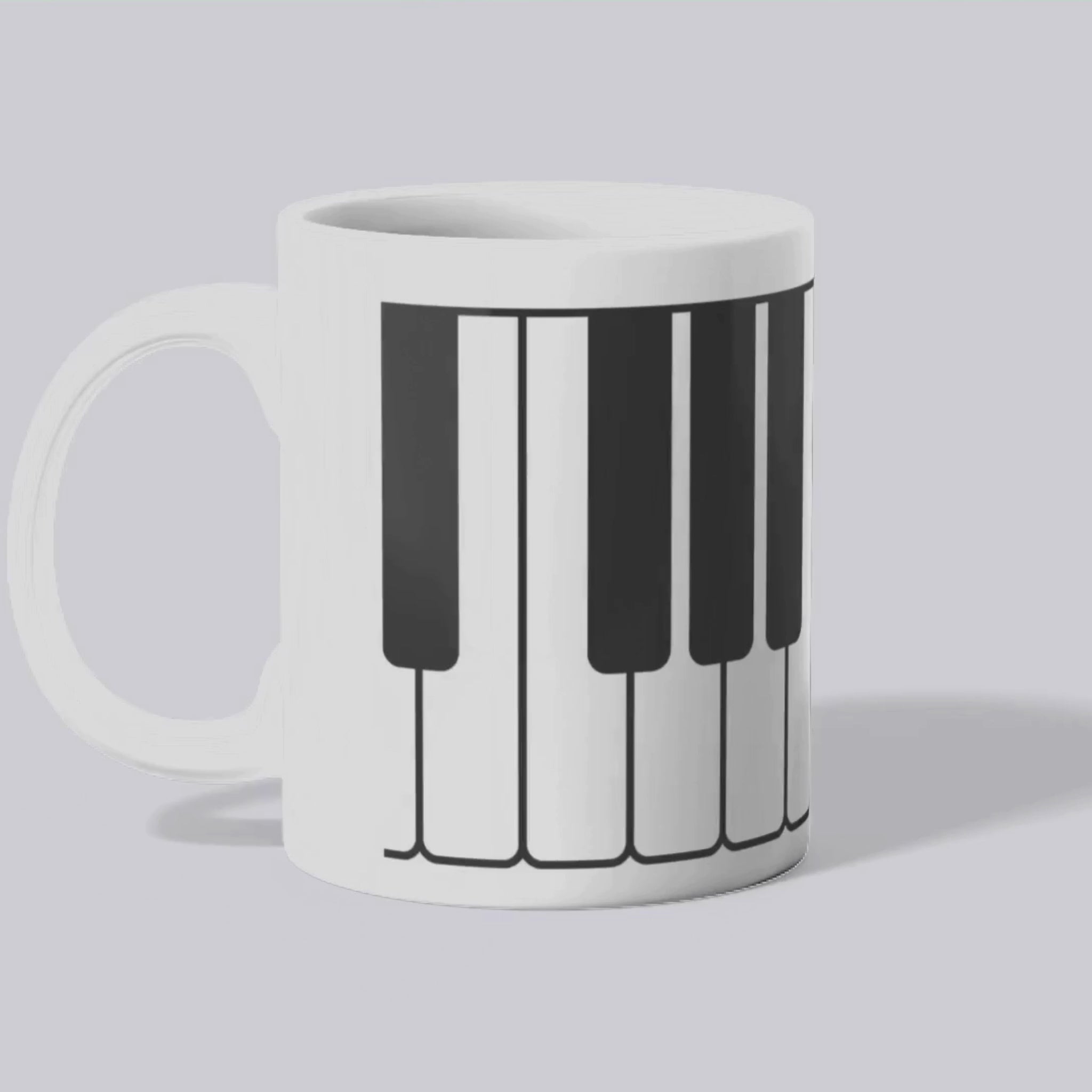 Mug blanc céramique 325ml orné d'une illustration d'un clavier de piano. Vidéo